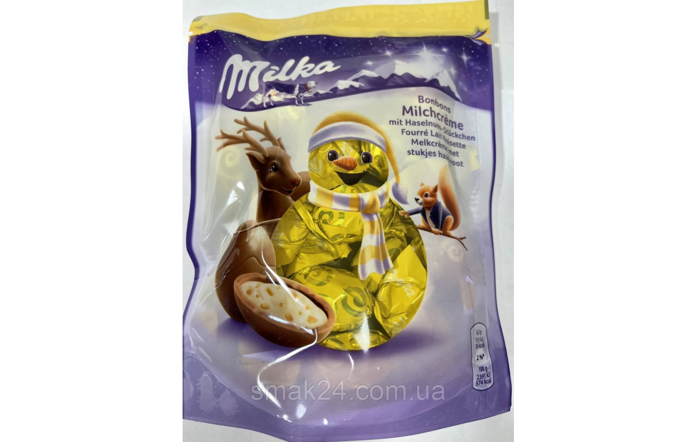 Шоколадні цукерки з кремом і лісовим горіхом Milka Bonbons Milchcreme 86 р Швейцарія