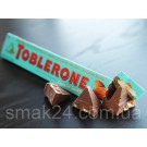 Швейцарський молочний шоколад Tobleron з медом, мигдалевою нугою і солоним карамельним мигдалем 100 г